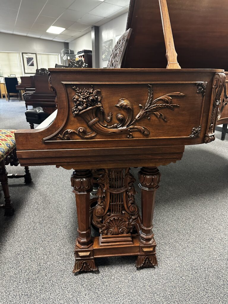 Historic grand piano details and restored cast iron plate with gilded gold plating