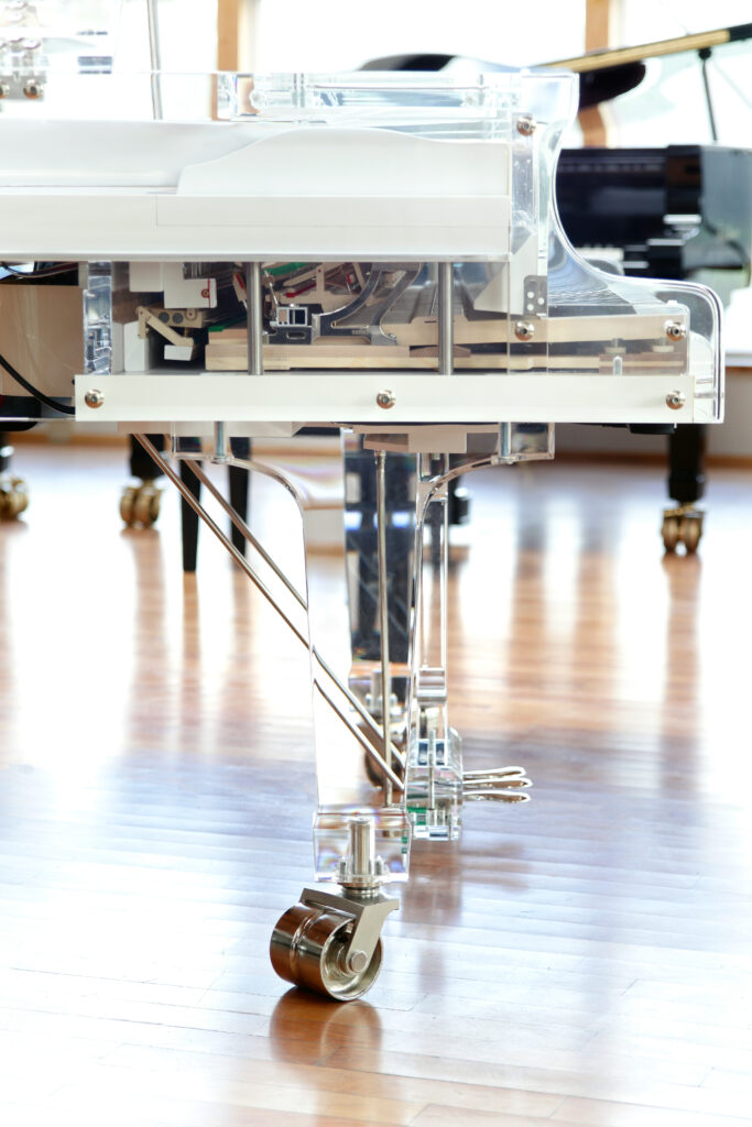 Close-up of transparent acrylic details on a Blüthner Crystal grand piano